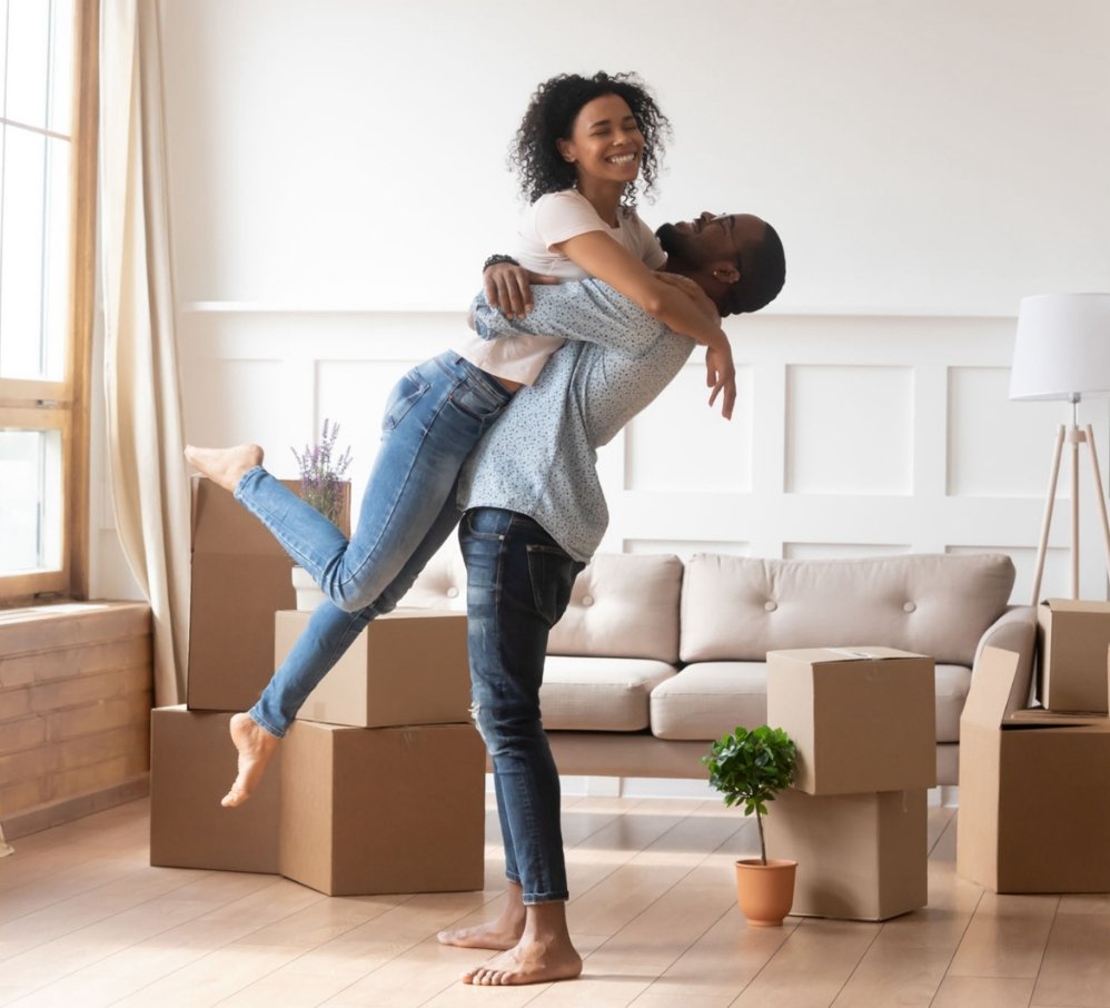 Couple celebrating moving into their new home
