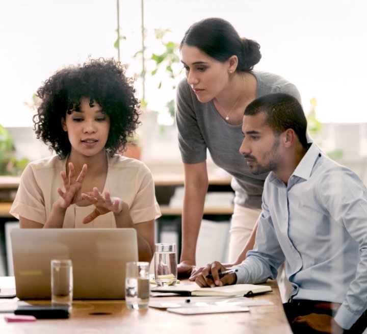 Diverse group working over a laptop