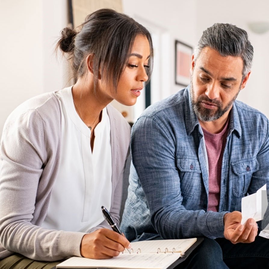 Couple working together to set up a budget